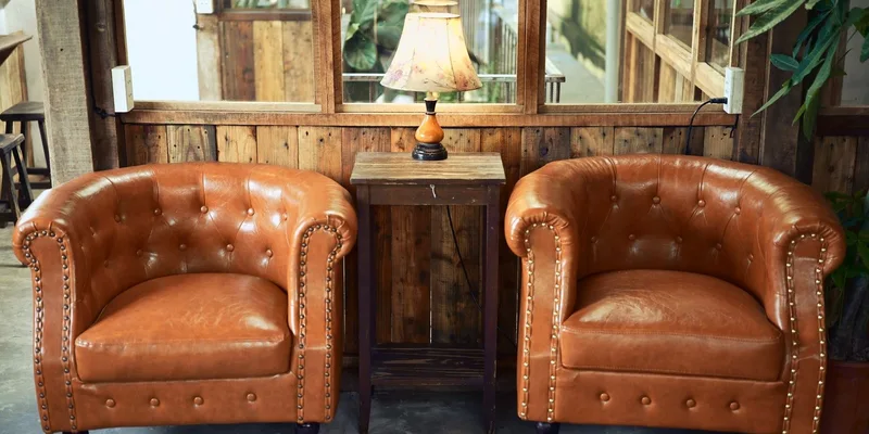 A power lift recliner tilted forward into the lift position in a sunlit living room.