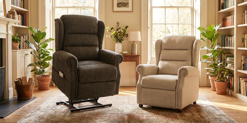 Two upholstered lift recliners of different sizes standing side by side in a bright living room.