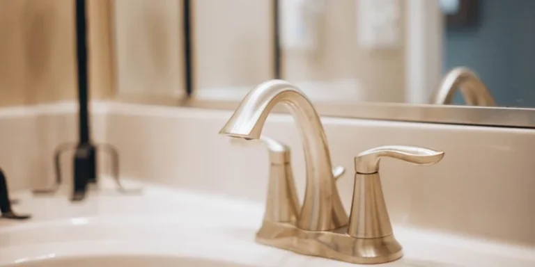 Three grab bars in polished stainless, white powder coat and textured knurled finishes on a bathroom counter.