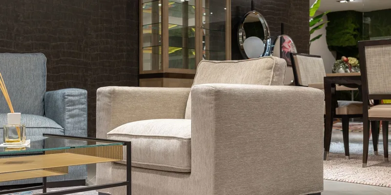 A lift recliner set against a living room wall with open floor space measured out around it.
