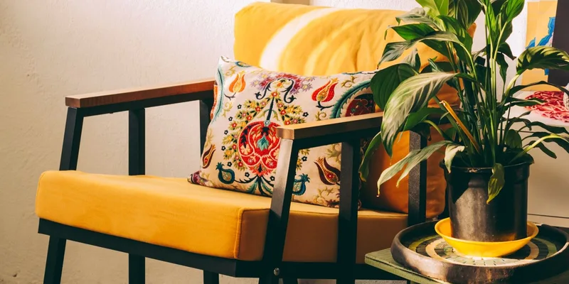 A petite lift recliner with a low seat in a small sunlit sitting room.